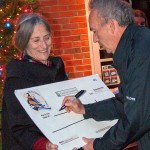 Mayor Bennett receives $5,000 check for Aurora from John Miller